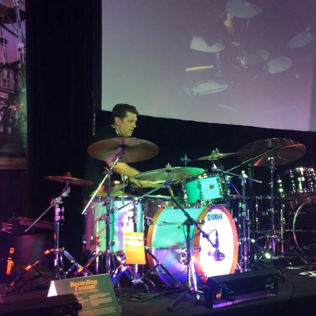 Darran Muller laying in down at the Yamaha display at